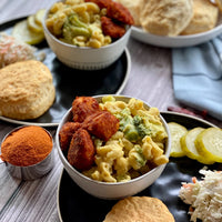 Nashville Hot Mac' n' Cheese: A Music City inspired pasta bowl. Crispy chick'n poppers tossed with Nashville hot spice. This fire is served on tender pasta with creamy, cheesy, velvety sauce to take the mid-south heat down a touch, completed with healthy broccoli to please your palate.
