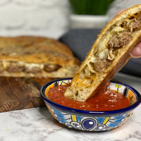 Stuffed Focaccia: Simple, Italian inspired meal has all the flavors of your favorite pizza. Golden, warm, yeasty bread stuffed with plant based savory sausage and cheese, served with a side of a robust sweet marinara sauce makes easy, fun party dinner.