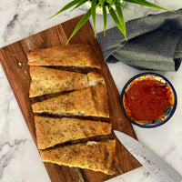 Stuffed Focaccia: Simple, Italian inspired meal has all the flavors of your favorite pizza. Golden, warm, yeasty bread stuffed with plant based savory sausage and cheese, served with a side of a robust sweet marinara sauce makes easy, fun party dinner.